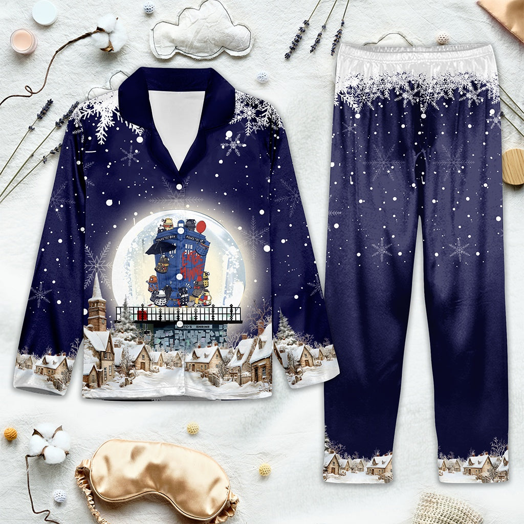 Navy blue Doctor Who-themed pajama set with Christmas scene design on a light gray background