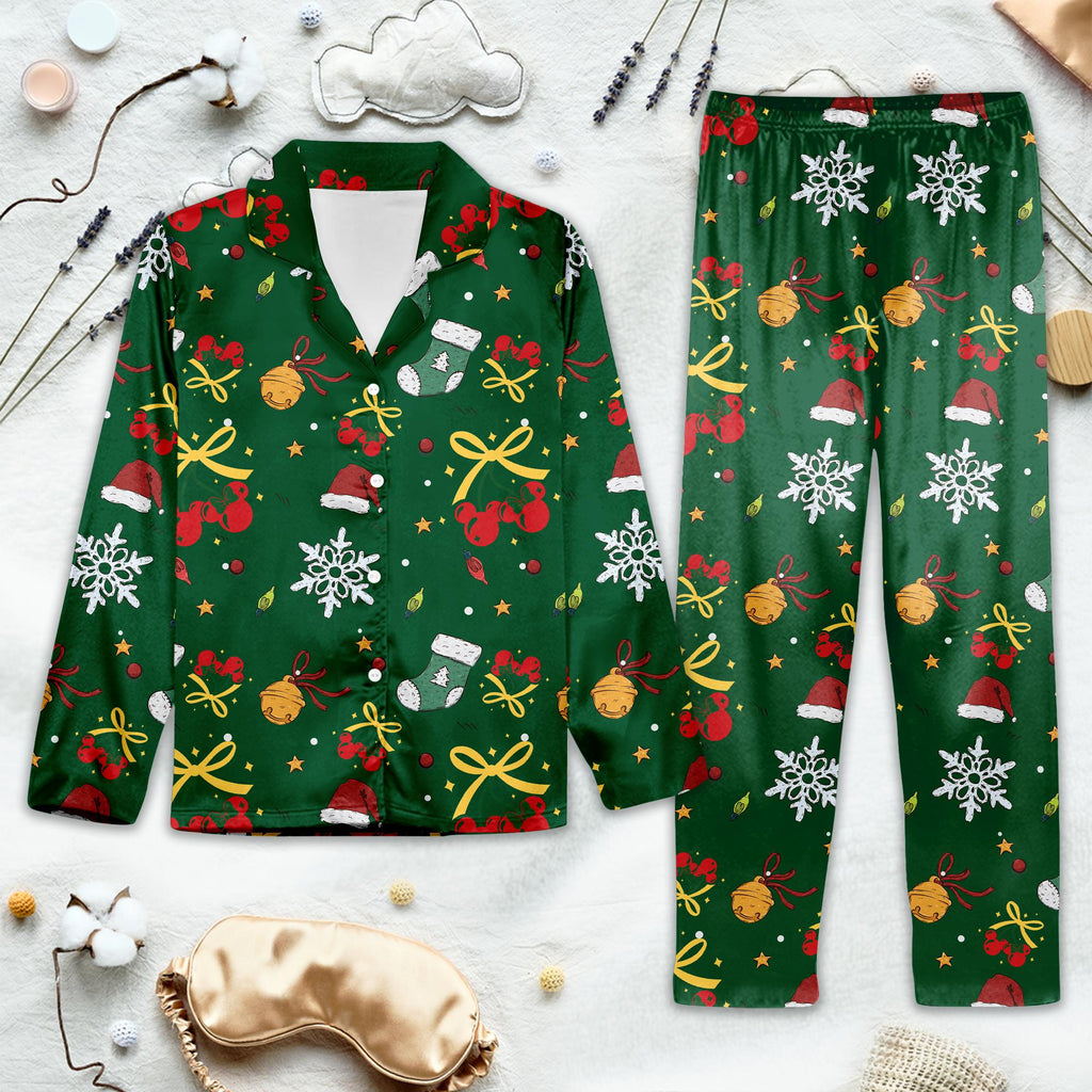 Green Christmas-themed pajama set with decorative cherry patterns on a light background