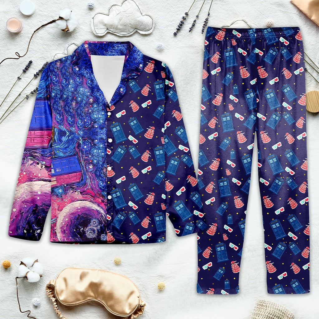 Navy blue Doctor Who pajama set with colorful patterns on a light gray surface.