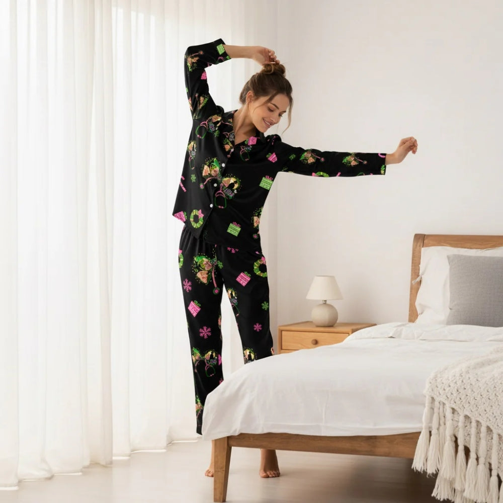 Woman in a black Christmas-themed pajama set with Wicked designs stretching in a bedroom.