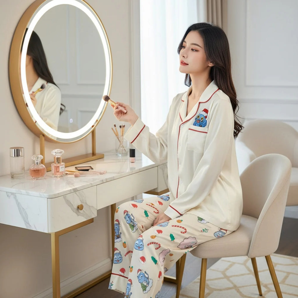 Woman in pajama set with colorful Derpy tiger patterns and holiday designs applying makeup in front of a mirror.