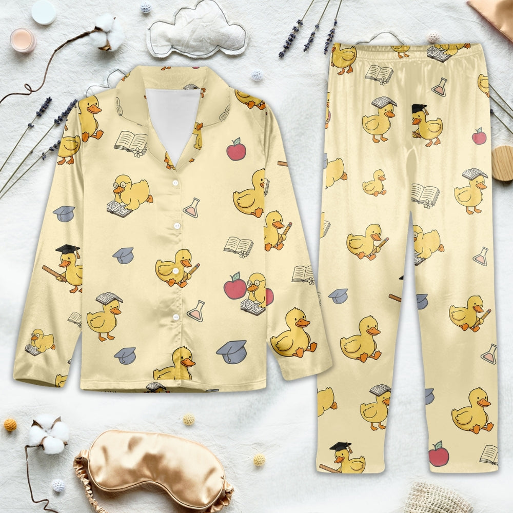 Pajama set features an adorable “scholar ducky” theme on a light background